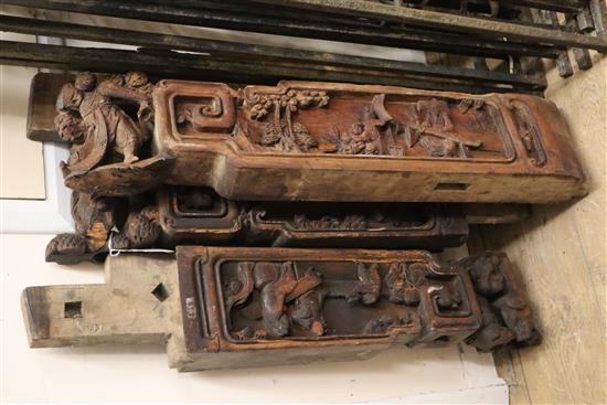 Four 19th century Chinese architectural beams, each carved with figures